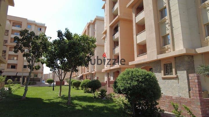 An apartment with a garden in a 1,000-acre compound with full services, in a special location in front of Cairo Airport, near Nasr City, Taj City. 5