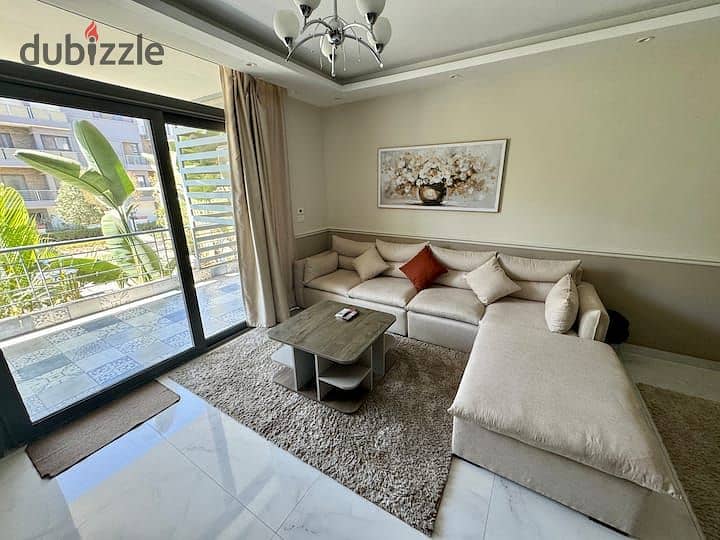 An apartment with a garden in a 1,000-acre compound with full services, in a special location in front of Cairo Airport, near Nasr City, Taj City. 7