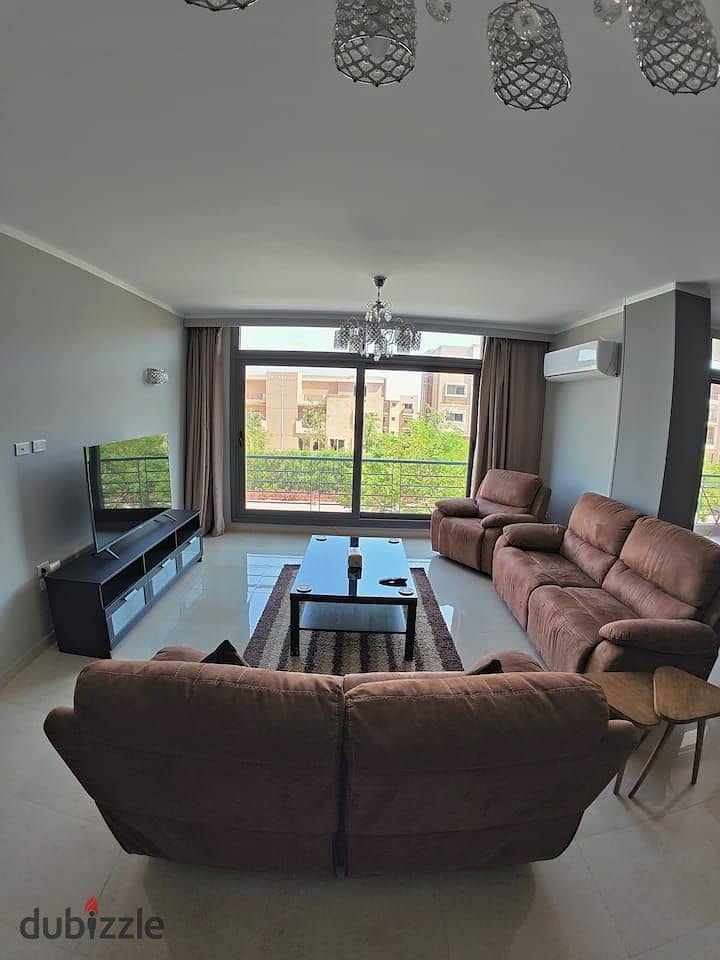 An apartment with a garden in a 1,000-acre compound with full services, in a special location in front of Cairo Airport, near Nasr City, Taj City. 8