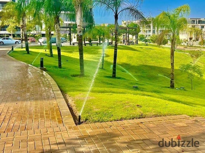 An apartment with a garden in a 1,000-acre compound with full services, in a special location in front of Cairo Airport, near Nasr City, Taj City. 9