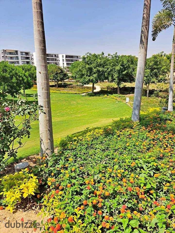 An apartment with a garden in a 1,000-acre compound with full services, in a special location in front of Cairo Airport, near Nasr City, Taj City. 13