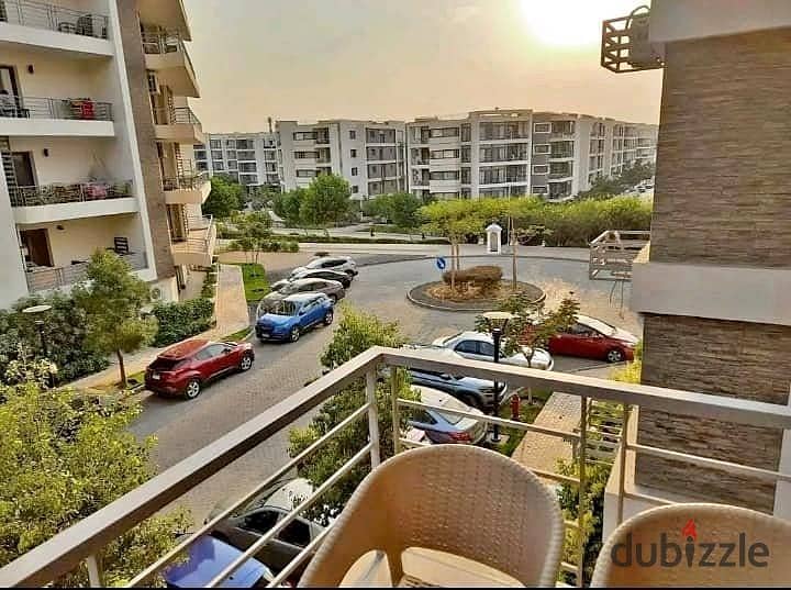 An apartment with a garden in a 1,000-acre compound with full services, in a special location in front of Cairo Airport, near Nasr City, Taj City. 14