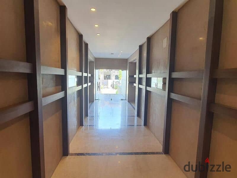 Apartment for sale in a garden in the heart of Golden Square, with a 5% down payment and equal installments, in Trio Gardens with M Square | With a 40 11