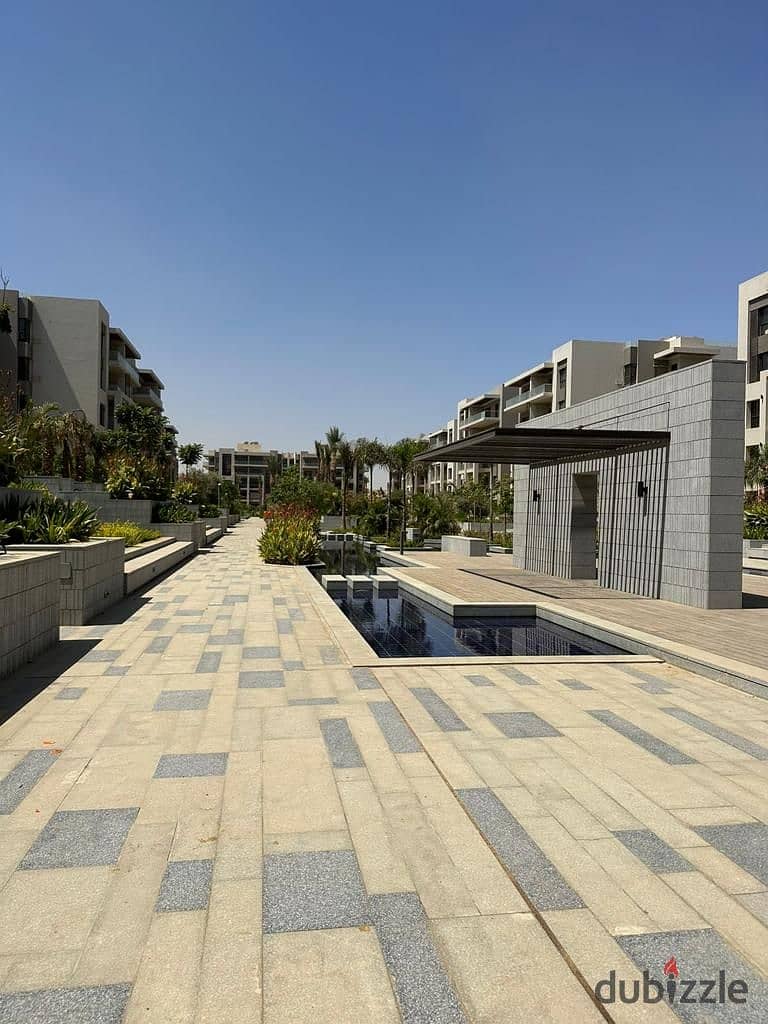 Apartment with garden for living in Address East, Fifth Settlement, fully finished and immediate receipt, next to Mountain View iCity and Palm Hills, 1