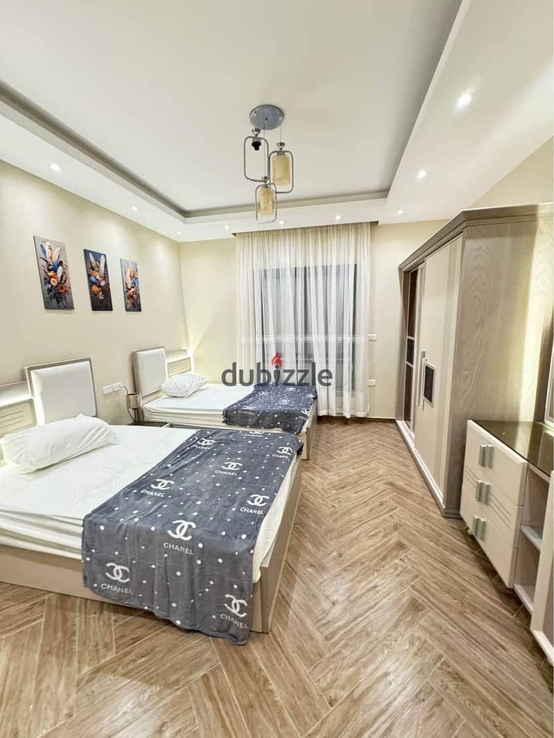 For a quick sale, I own a fully finished apartment at the price of the past in the most prestigious compound in the heart of old Sheikh Zayed, in fron 3