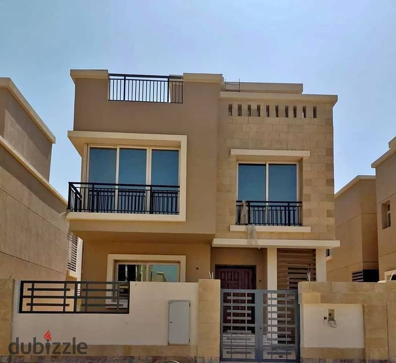 Corner villa for sale in New Cairo in Tag City, a very special location in front of Cairo International Airport 2