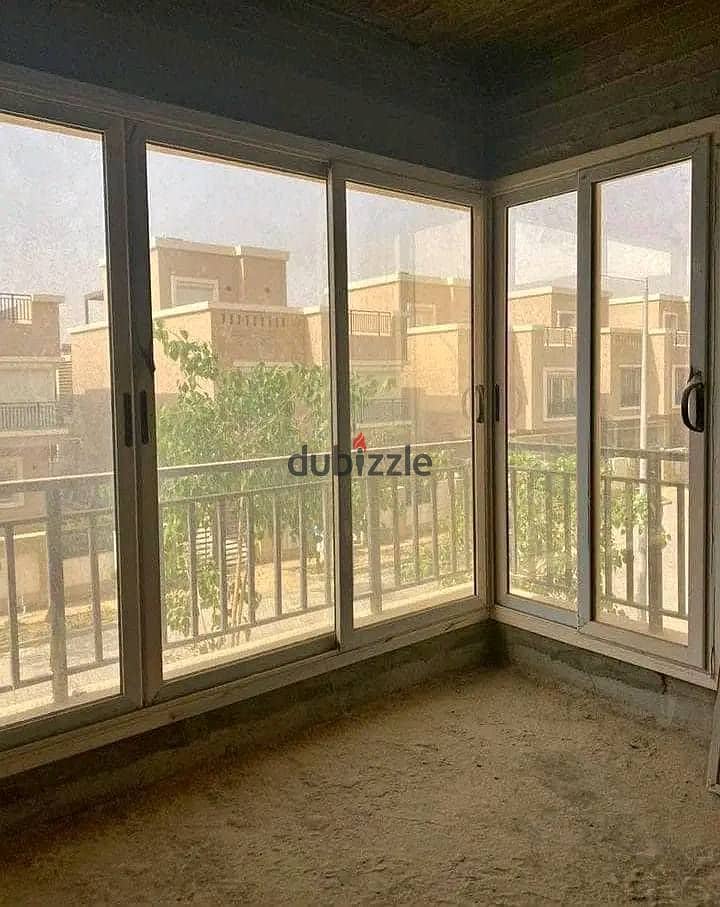 Corner villa for sale in New Cairo in Tag City, a very special location in front of Cairo International Airport 3