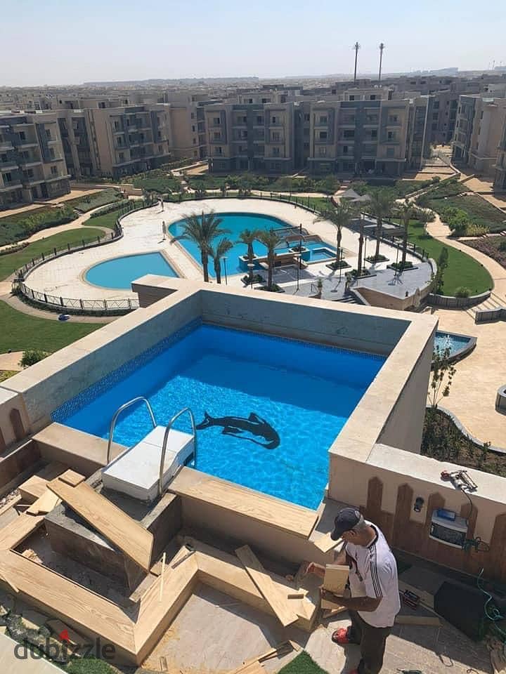 Own a penthouse in equal installments, ready to move with private roof 100 meters in the Fifth Settlement - 37% cash discount in Galleria 2