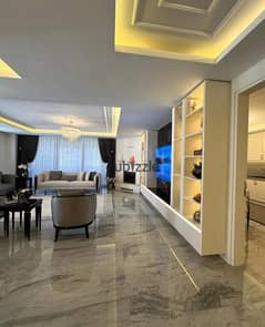 A snapshot apartment for sale, fully finished, with the lowest down payment and price, in Swan Lake West Compound, Sheikh Zayed