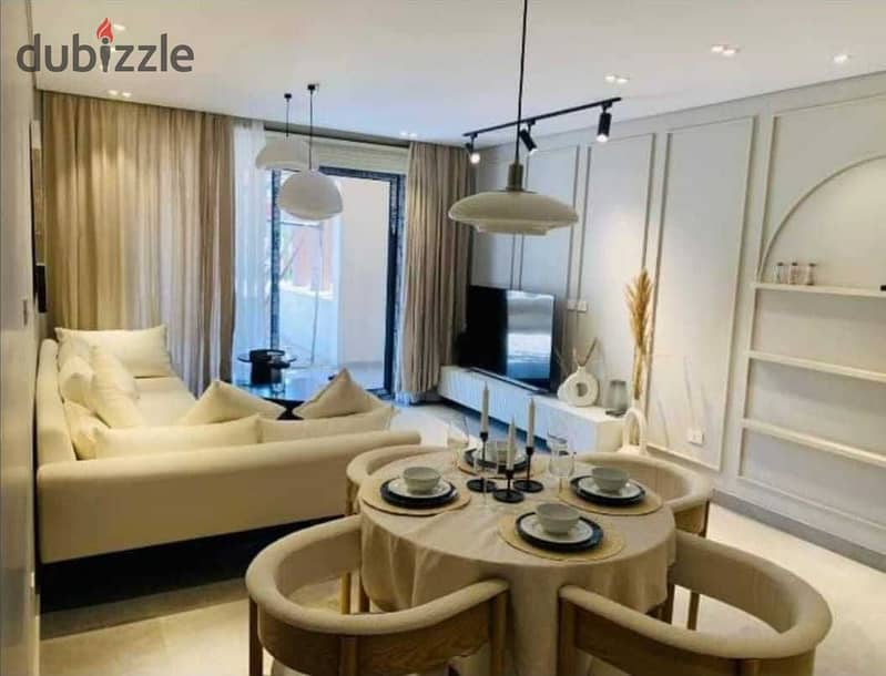 A snapshot apartment for sale, finished, with air conditioners, at a fantastic price, in Village West Compound, Sheikh Zayed, in installments over 5 y 2