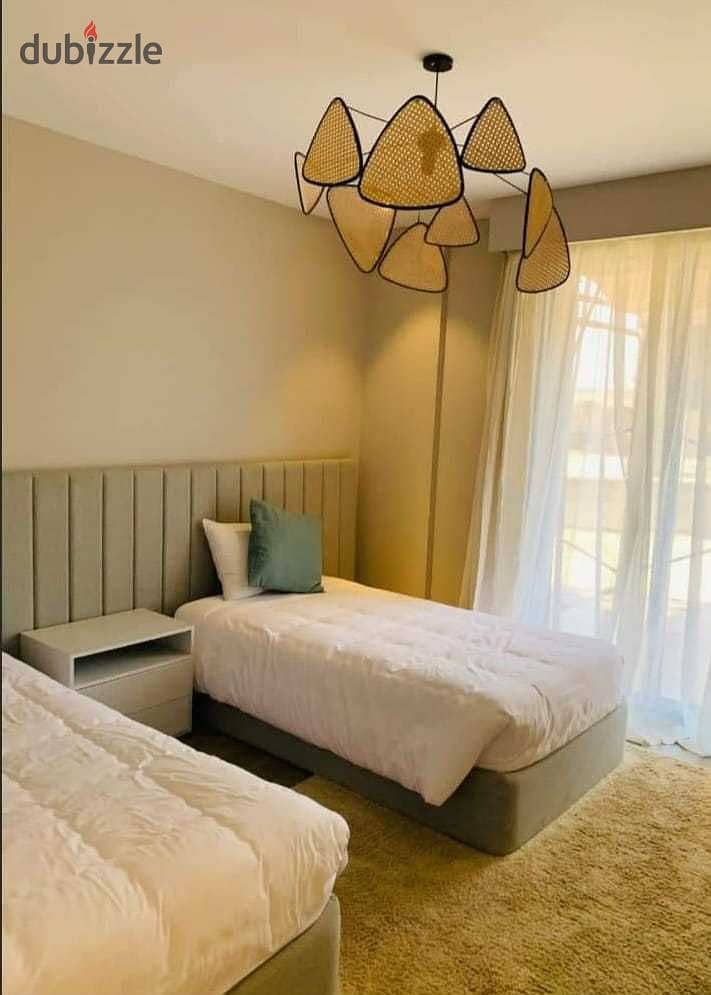 A snapshot apartment for sale, finished, with air conditioners, at a fantastic price, in Village West Compound, Sheikh Zayed, in installments over 5 y 7