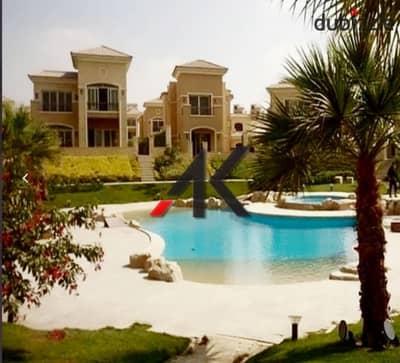 Direct overlooking lagoon - installment Town Middle For Sale in Telal East - New Cairo