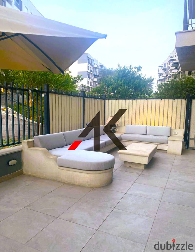 Prime Location Furnished Apartment with garden For Rent in Eastown - New Cairo 1