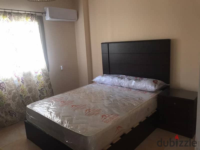 Fully furnished apartment for rent, air-conditioned, in Ashrafia Compound, First Settlement 10