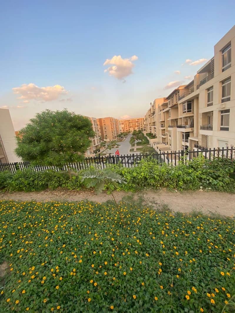 Two ground floor rooms with a garden of 115 m with a private garden of 60 m for sale in front of Cairo Airport in Taj City Compound, with installments 3