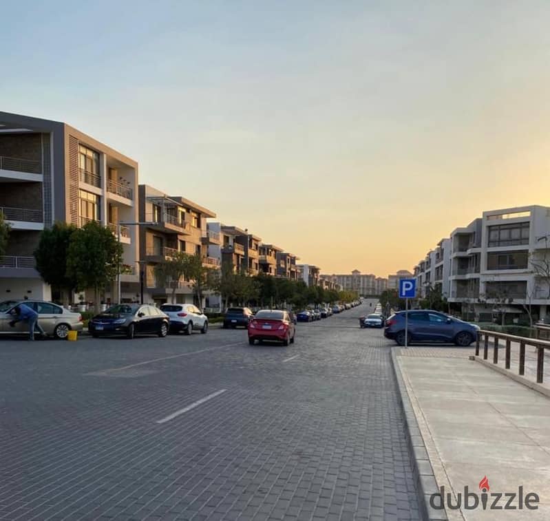 Two ground floor rooms with a garden of 115 m with a private garden of 60 m for sale in front of Cairo Airport in Taj City Compound, with installments 7