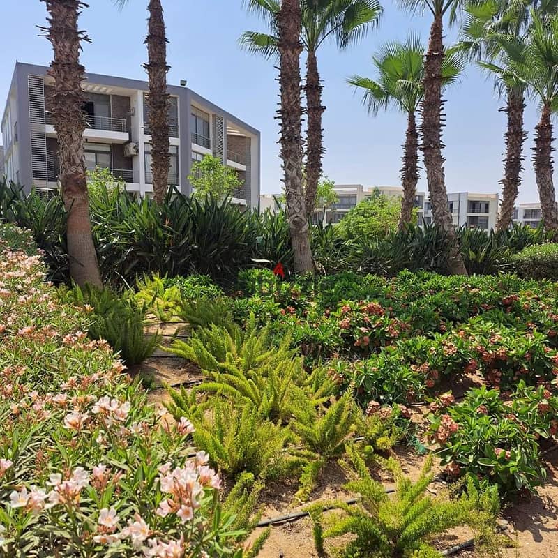 Two ground floor rooms with a garden of 115 m with a private garden of 60 m for sale in front of Cairo Airport in Taj City Compound, with installments 13