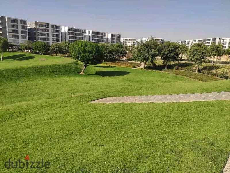 Two ground floor rooms with a garden of 115 m with a private garden of 60 m for sale in front of Cairo Airport in Taj City Compound, with installments 16