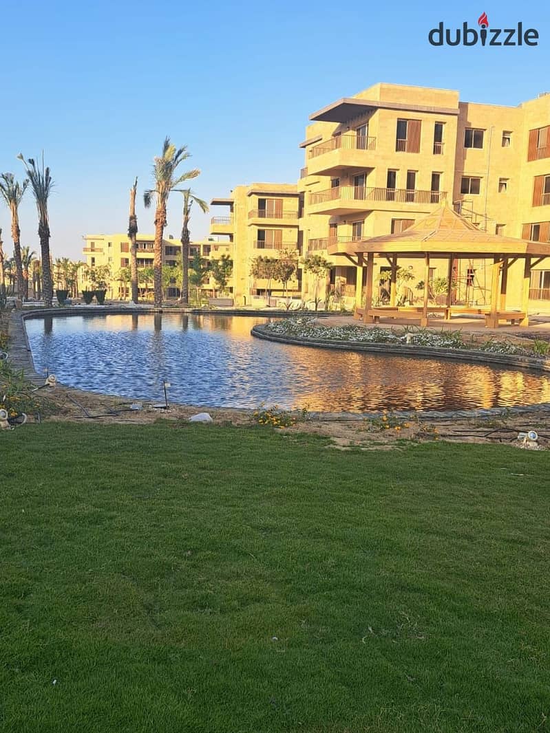 Two ground floor rooms with a garden of 115 m with a private garden of 60 m for sale in front of Cairo Airport in Taj City Compound, with installments 19