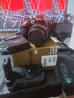 Nikon D 5300 with kit lens 18-55 and 2 batteries and battery grib