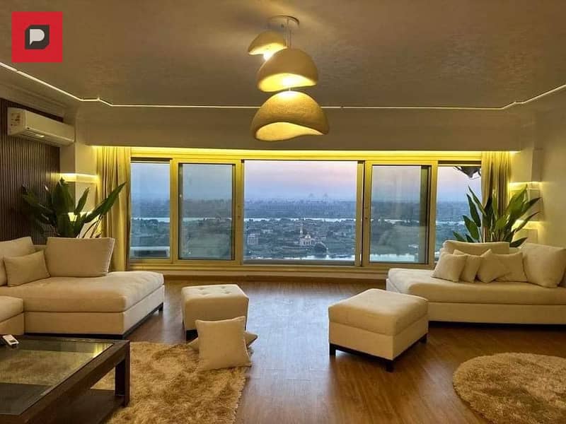 Service apartment for sale on the Nile in Maadi Corniche, finished with Acs and furniture,  on the 14th floor, overlooking Nile 1