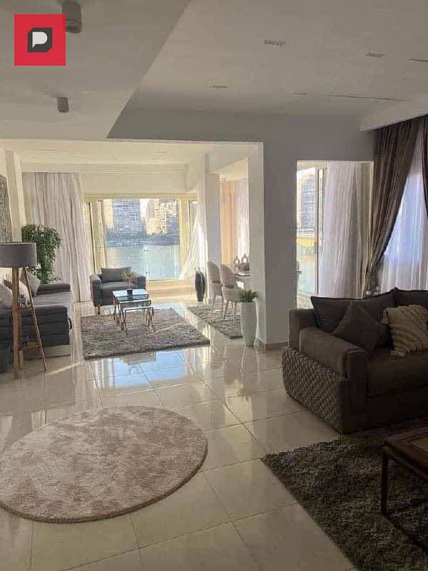 Service apartment for sale on the Nile in Maadi Corniche, finished with Acs and furniture,  on the 14th floor, overlooking Nile 14