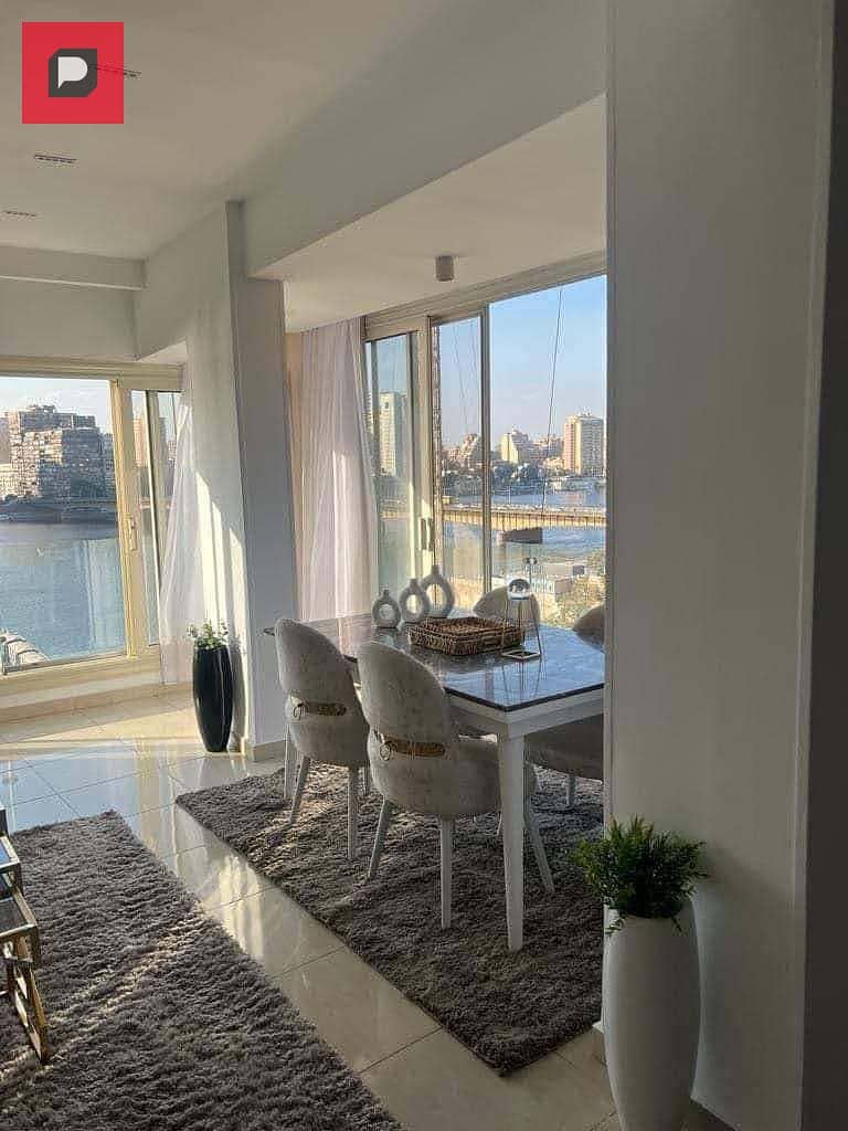 Service apartment for sale on the Nile in Maadi Corniche, finished with Acs and furniture,  on the 14th floor, overlooking Nile 15