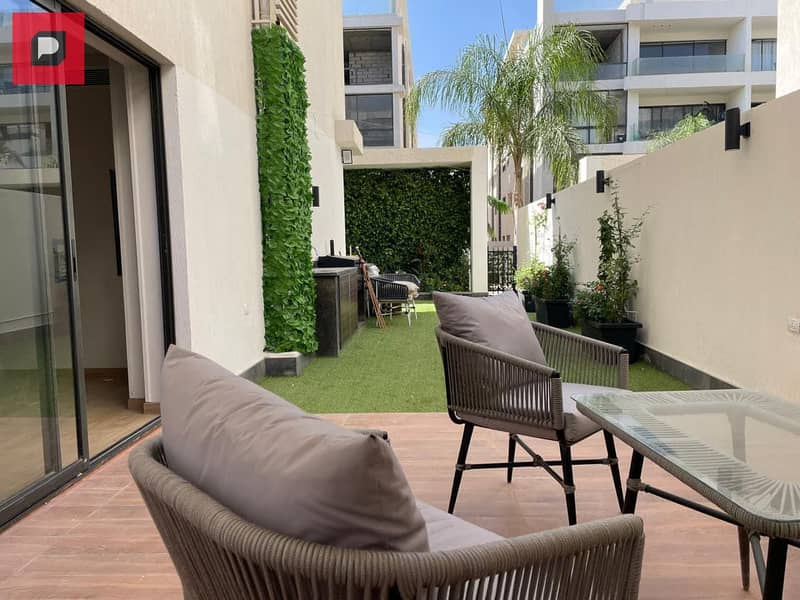 Apartment for sale with a private garden in the heart of New Cairo with 10% down payment and 8 year installments front of Cairo International Airport 2