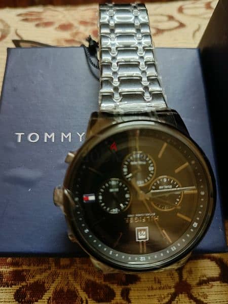 ساعه تومي tommy اصليه جديده باللزق بتاعها 2