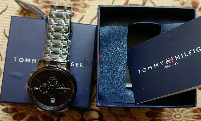 ساعه تومي tommy اصليه جديده باللزق بتاعها 3