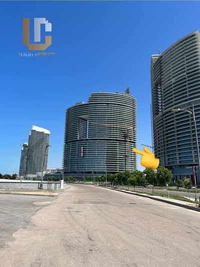 Resale apartment, immediate receipt, fully finished, in Al Alamein Towers, full sea view, The Gate Towers, at less than the company price.