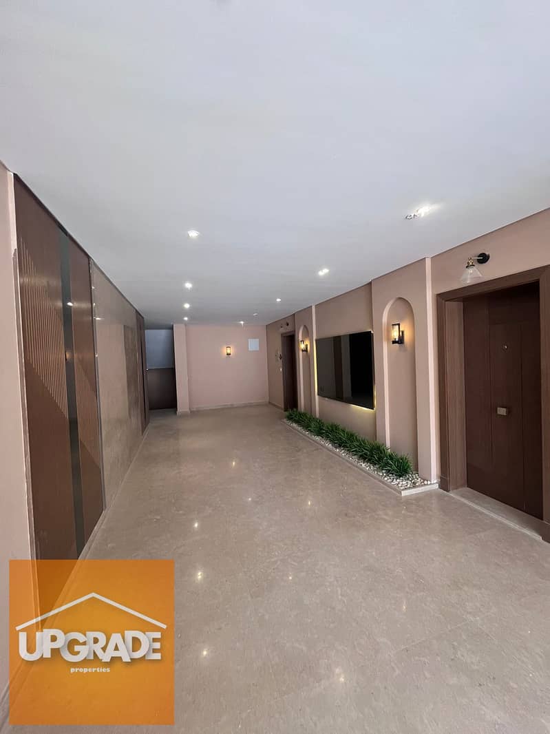 A fully finished apartment for sale with a total area of 159 sqm, ready to move in Village West compound, heart of Sheikh Zayed. With a 30% discount. 26