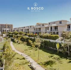 For sale apartment with a garden 114 m ready to move prime location under market price in El Bosco Compound