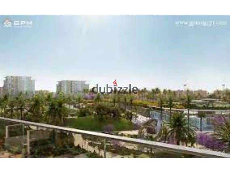 Apartment for sale in a garden, open to the largest view and landscape, in the best location in New Cairo, in installments. 2