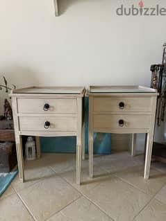 Two wooden nightstands with glass