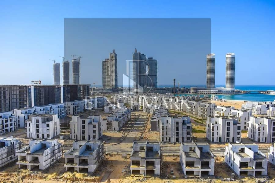 Apartment for sale in Garden 3 rooms Mazarine Compound North Coast, delivery soon, double view on El Alamein Towers next to Marina, in installments 3