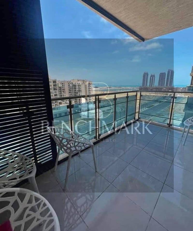 Apartment for sale in Garden 3 rooms Mazarine Compound North Coast, delivery soon, double view on El Alamein Towers next to Marina, in installments 12