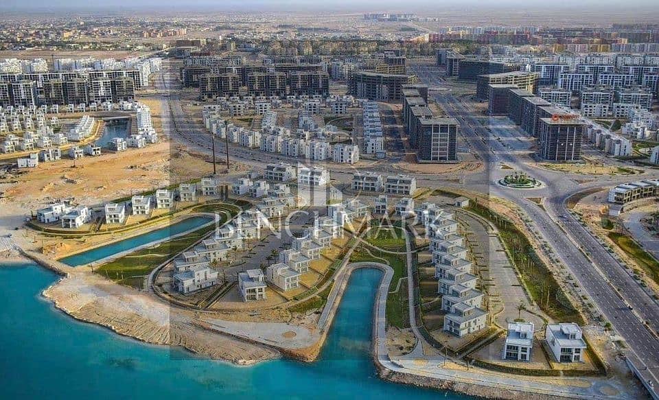 Apartment for sale in Garden 3 rooms Mazarine Compound North Coast, delivery soon, double view on El Alamein Towers next to Marina, in installments 14