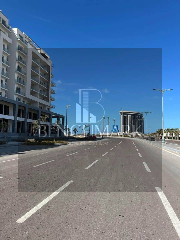 Apartment for sale in Garden 3 rooms Mazarine Compound North Coast, delivery soon, double view on El Alamein Towers next to Marina, in installments 15