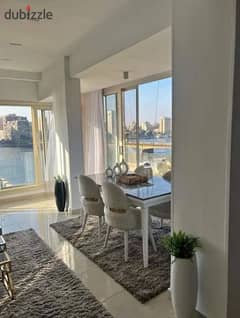 Hotel apartment with furnishings and air conditioners for sale in a tower directly in front of the Nile