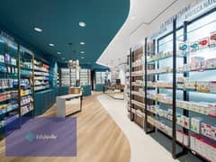 Pharmacy at the opening price, first row in front of Al Masa Hotel, first row in the promenade and shopping district, with the lowest down payment and 0