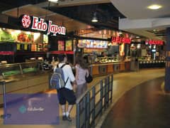 A food court restaurant in the largest mega mall, with an international hotel and swimming pools, first row on the western axis and in front of the ba 0