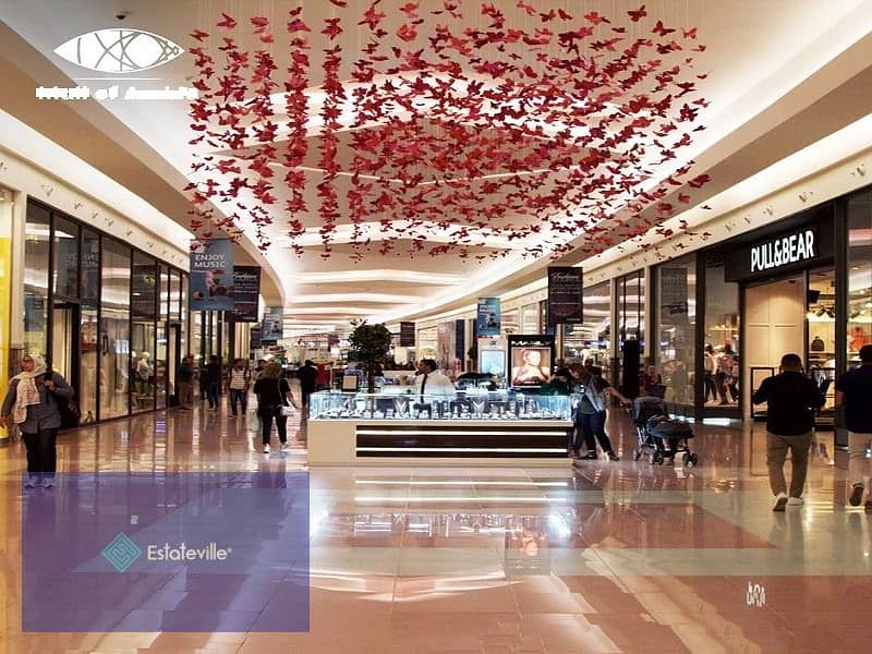 A ground floor store with the lowest down payment and the most distinguished shopping mall in front of Al Masa Hotel and the monorail station with an 8