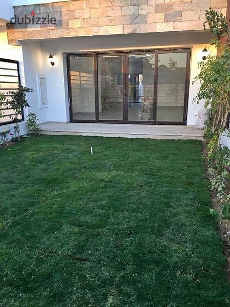 Ground floor apartment with garden (immediate delivery) for sale in Taj City Compound 0