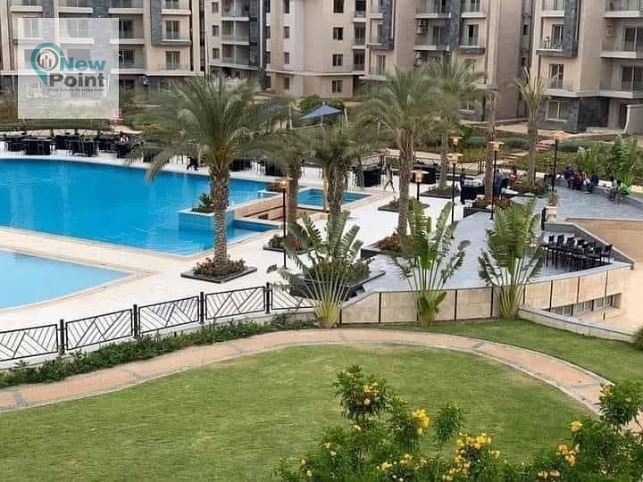 A distinctive ground floor apartment with a garden for sale in Palm Hills New Cairo Direct Compound, directly on the Ring Road 1