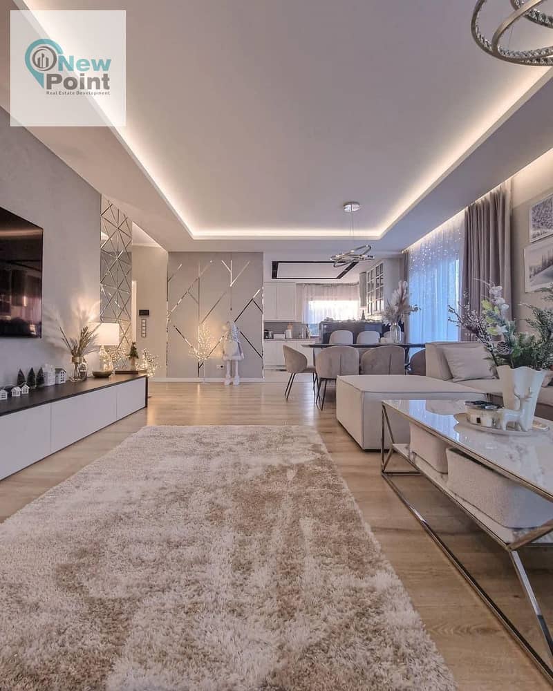 A distinctive ground floor apartment with a garden for sale in Palm Hills New Cairo Direct Compound, directly on the Ring Road 2