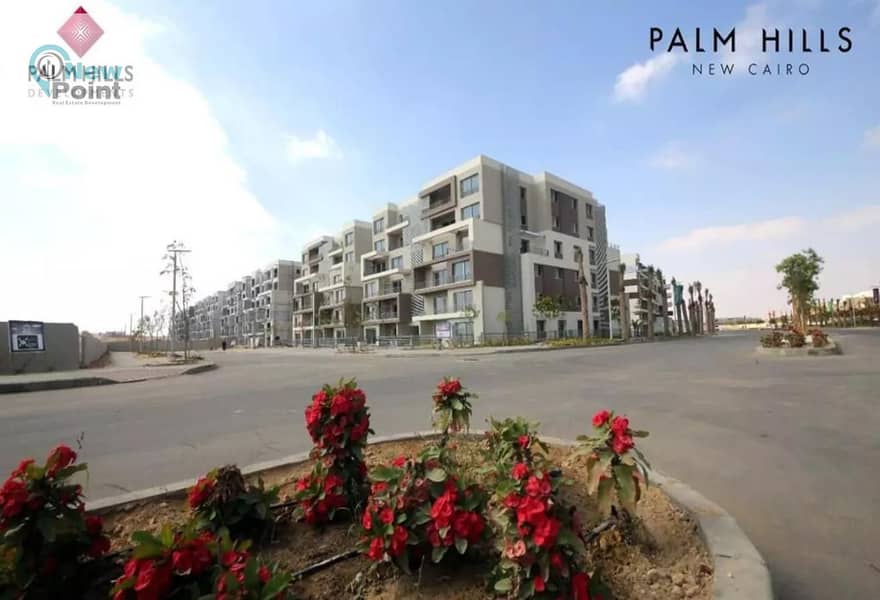 A distinctive ground floor apartment with a garden for sale in Palm Hills New Cairo Direct Compound, directly on the Ring Road 9