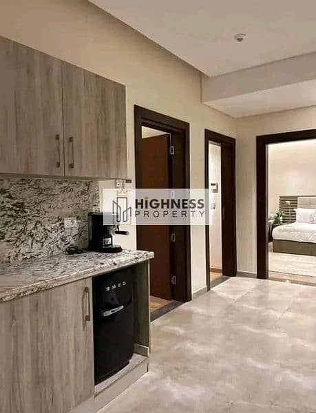 Apartment for sale, ground floor, area of ​​166 meters, at a special price, and a garden of 100 meters , directly on Suez Road, in Taj City, New Cairo 4