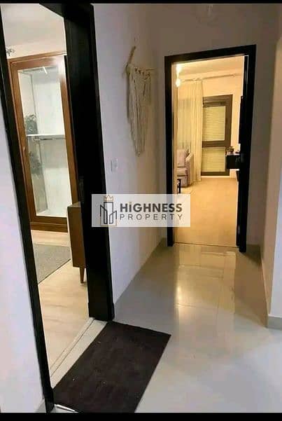 Apartment for sale, ground floor, area of ​​166 meters, at a special price, and a garden of 100 meters , directly on Suez Road, in Taj City, New Cairo 15