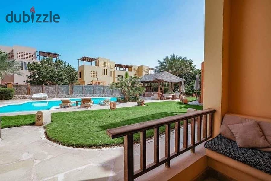 For sale, a finished townhouse villa with air conditioners and kitchen, first row on the Lagoon in El Gouna 7